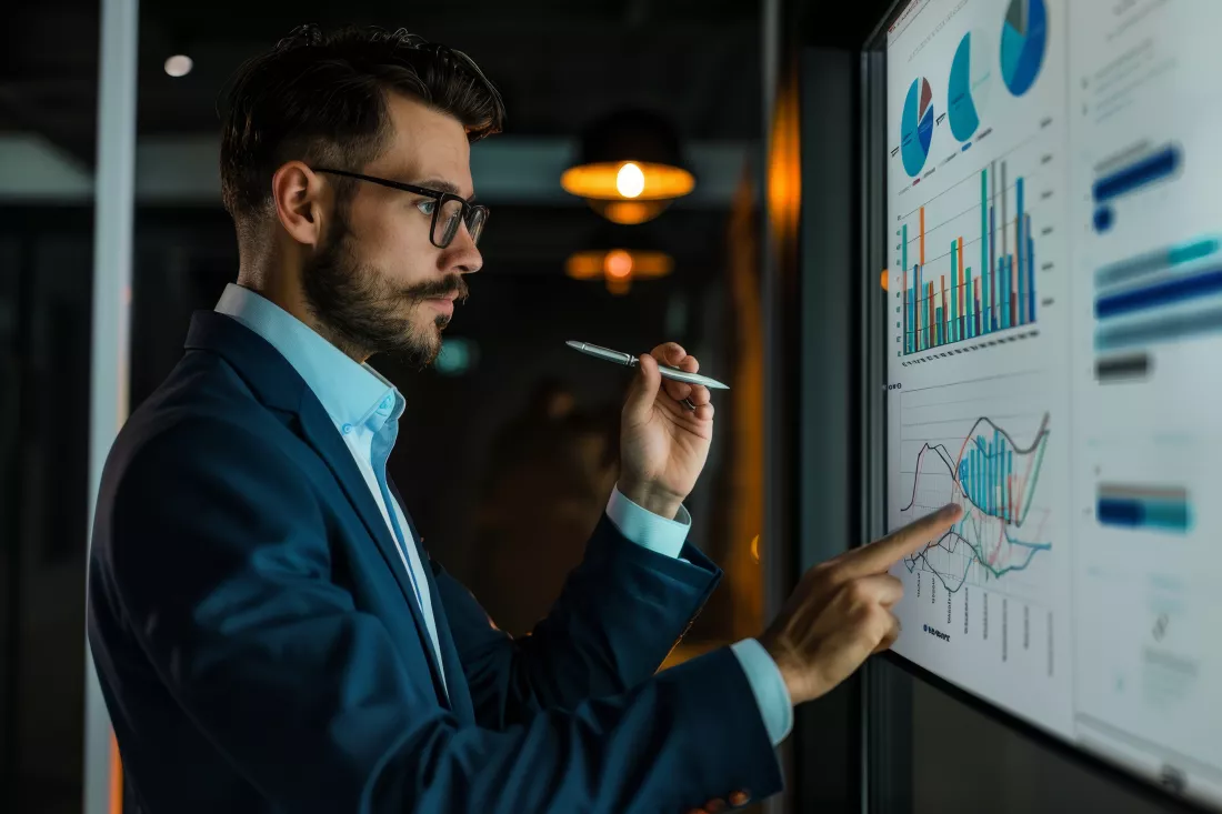 man-standing-front-projection-screen-analyzing-data-company-growth-business-man-strategizing-growth-company-meeting